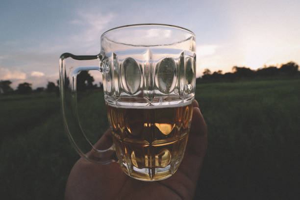 istock southeast asian man happily drinking beer 1189898467