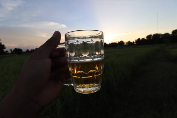 istock southeast asian man happily drinking beer 1189898617