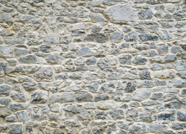 istock New gray stone wall closeup 1189899441
