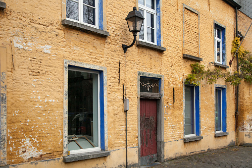 Horizontal view of an old orange building façade in Patershol district, Ghent