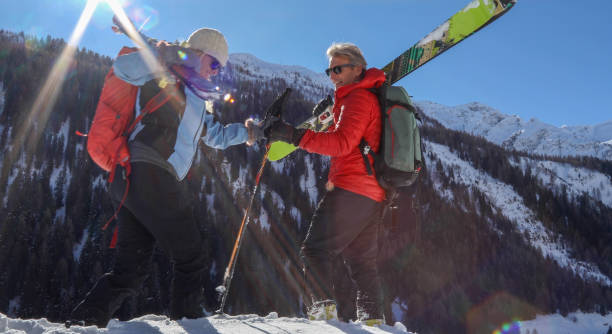 istock Mature backcountry skier step up powder snow ledge 1189901985