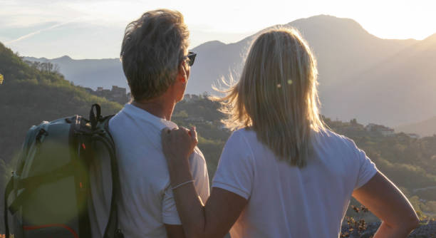 istock Mature couple hike above hills 1189902034