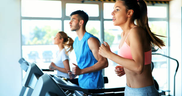 istock Young attractive woman doing cardio training in gym 1189902574