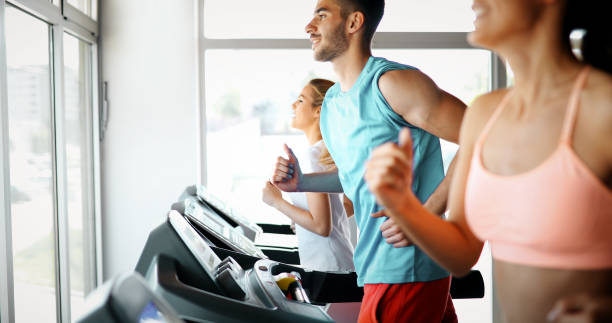 istock Young attractive woman doing cardio training in gym 1189902588