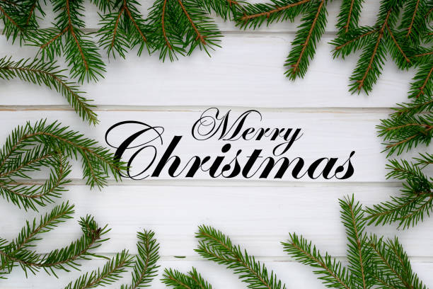 istock Merry Christmas background, green fir branches, white boards 1189902745