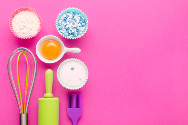 istock ingredients for baking and kitchen tools on pink background with copy space 1189903214