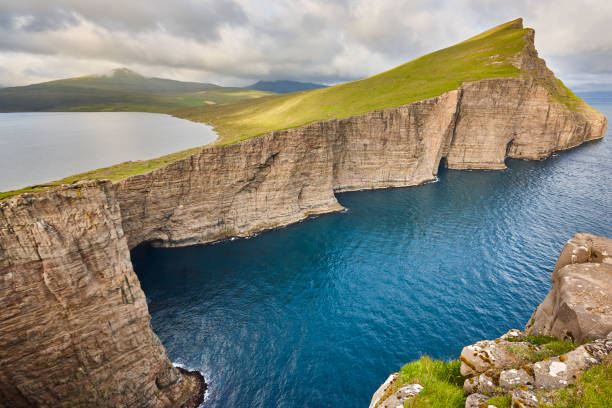 istock Dramatic atlantic rocky coastline cliffs landscape in Vagar. Faroe 1189903463