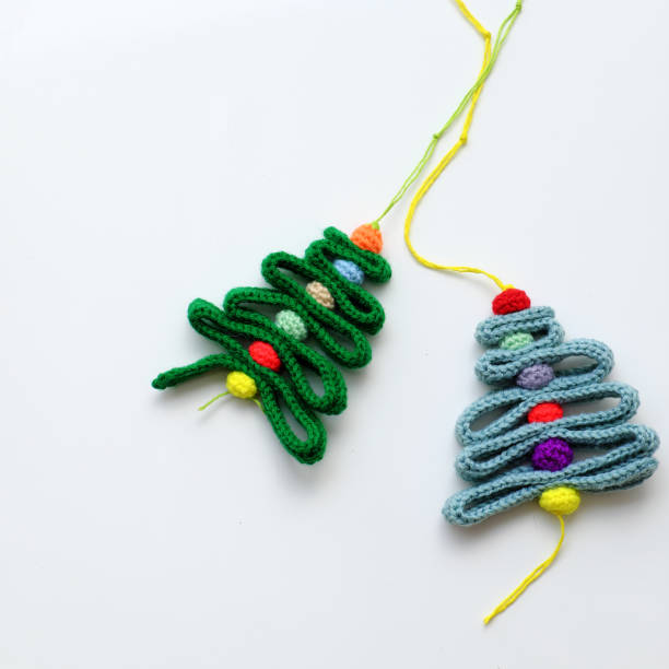 istock Christmas ribbon tree and colorful baubles on white background 1189903550