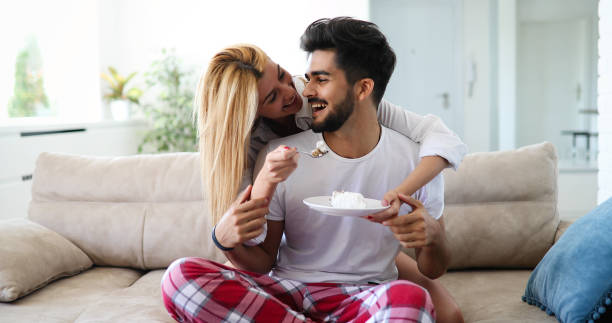 istock Cute young cheerful couple spending time at home 1189903920