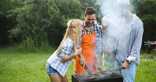 istock Friends spending time in nature and having barbecue 1189905002