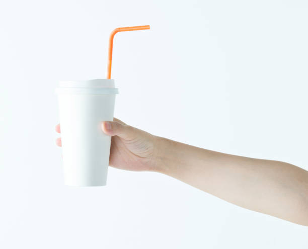 istock Woman hand holding a white disposable cup 1189907032