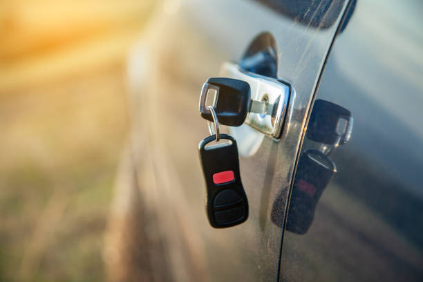 istock key on car door in nature 1189907979