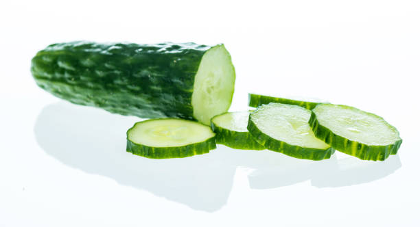 istock Fresh cucumber slices on white background 1189908582