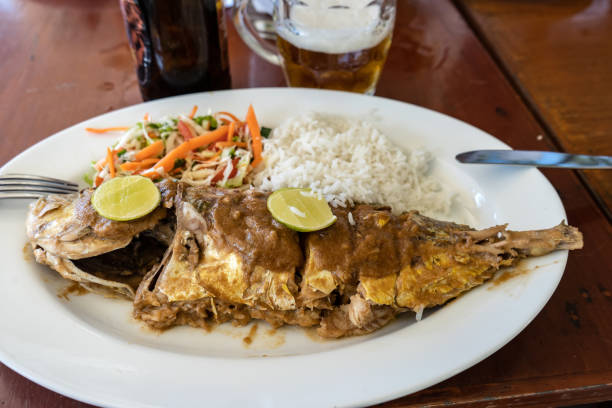 istock Grilled fish with salad and side dish on a table in a restaurant 1189908660