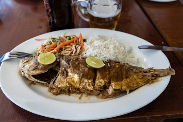 istock Grilled fish with salad and side dish on a table in a restaurant 1189908689