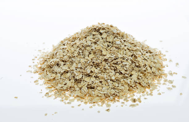 istock A heap of oat flakes on white background 1189909082