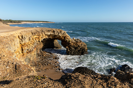 Rocky arch on the coast of la Pointe du Payre in Jard sur Mer (Vendee, France)