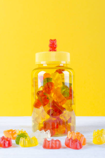 istock vitamins for children like jelly candy on yellow background 1189911325