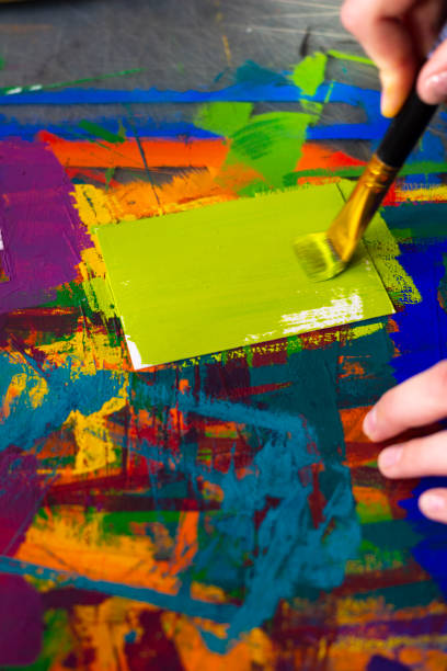 istock Art college student make Itten color wheel for basic color theory 1189913045