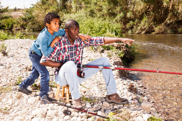 istock Fishermen - boy and his father 1189913068