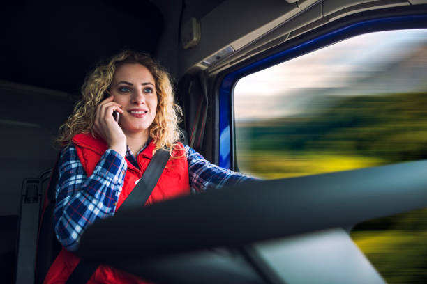 Truck driver talking on the phone while driving. Blurred motion.