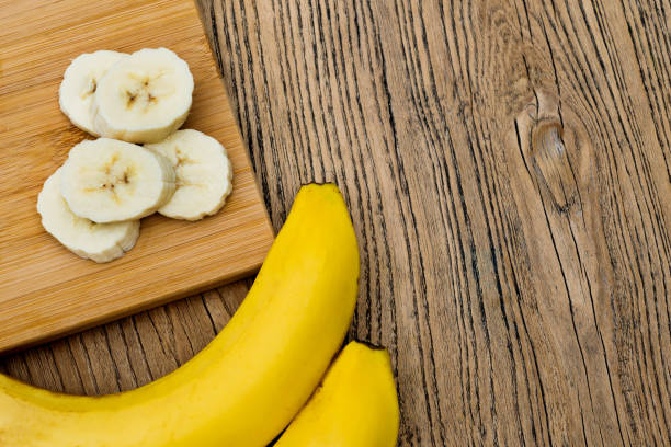 istock Banana slices on cutting board 1189914669