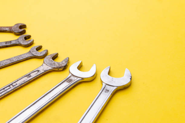 istock Old wrenches on a yellow background.. Copy space 1189919818