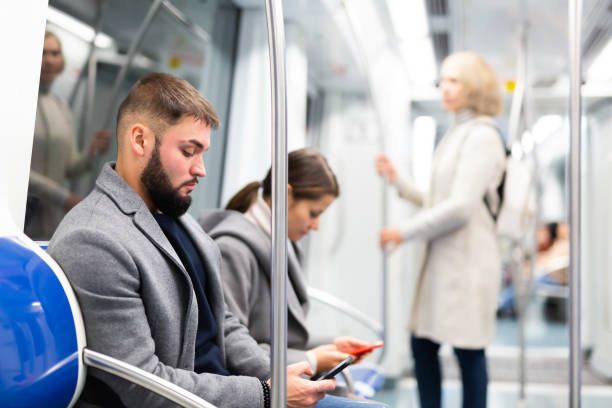 istock People browsing in smartphone in subway 1189920217