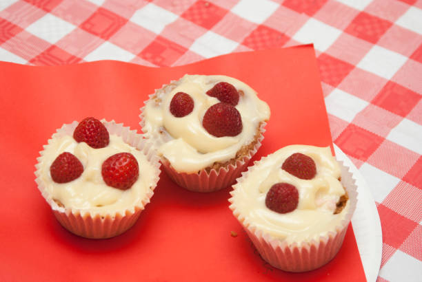 Strawberry cupcakes on the red background