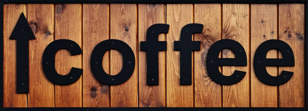 istock Lettering Coffe. Black letters on a wooden board. 1189922641