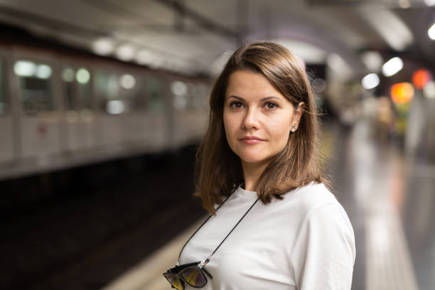 istock Woman waiting subway car on platform 1189922697
