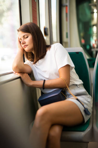 istock Woman sleeping n public transport 1189922717