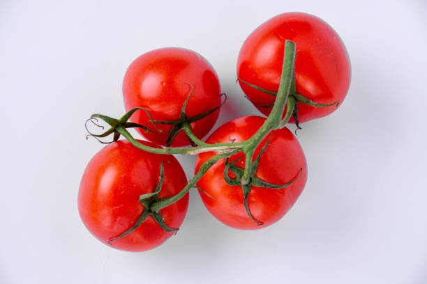 istock Bunch of tomatoes on white background 1189922839