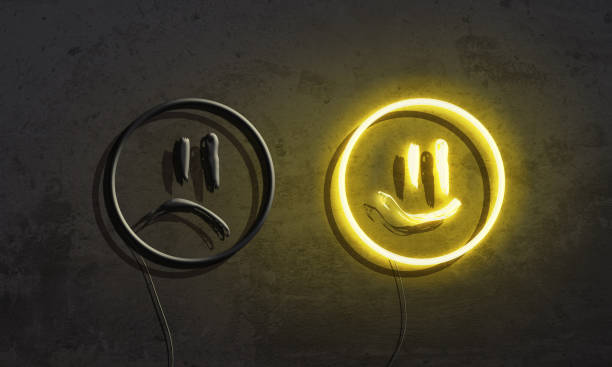 Neon smiles on grunge concrete wall stock photo