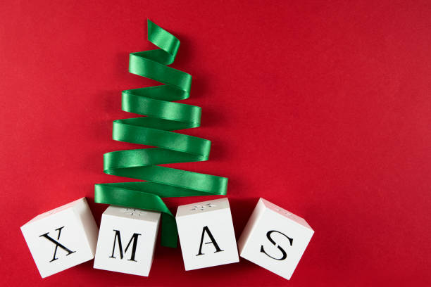 istock Green Christmas Tree with Ribbon 1189924334