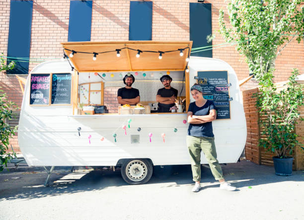 Happy entrepreneurs in the food truck stock photo