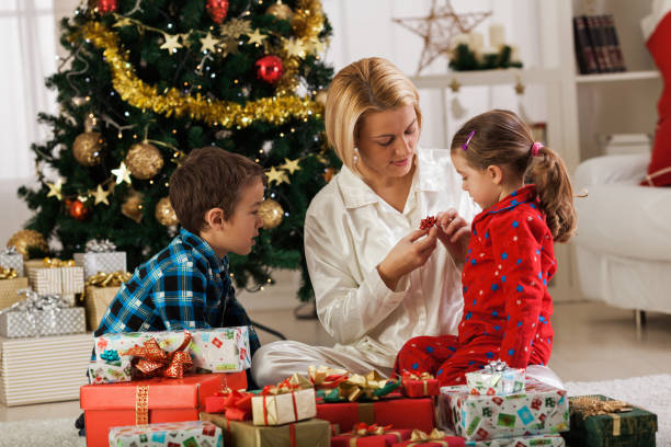 istock Family opening Christmas presents 1189924620