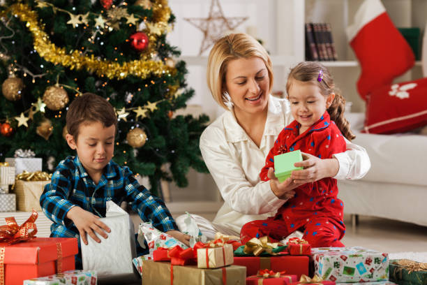 istock Family opening Christmas presents 1189924648
