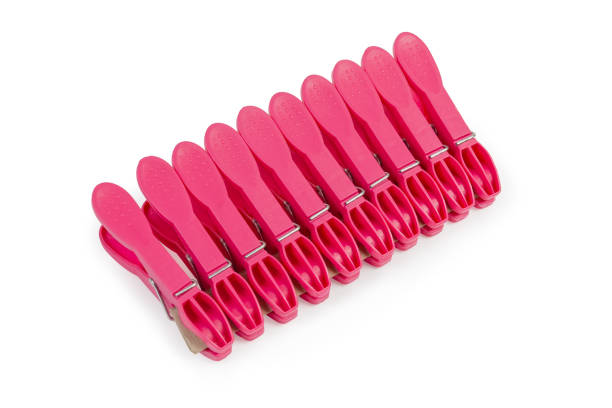 istock Set of red plastic clothespins on a white background 1189924731