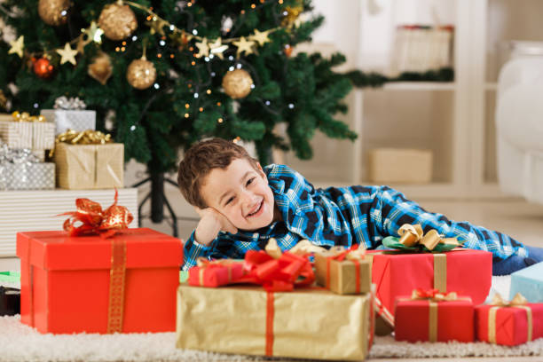 istock Smiling boy and his Christmas presents 1189924822