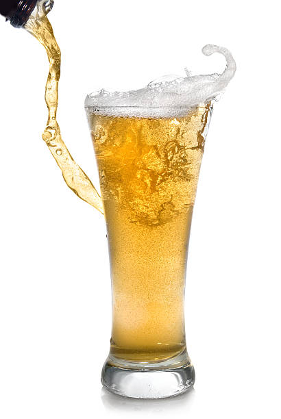 istock Beer pouring from bottle into glass 118992558