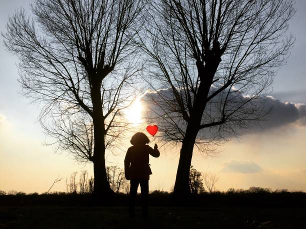istock Man il love with a heart shaped balloon 1189925778