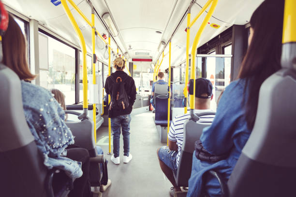istock Men and women commuting by bus 1189927257