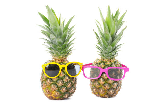 istock Pineapples with glasses isolated on white background. Juicy fruit 1189928811