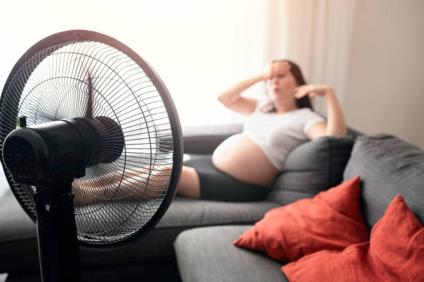 Pregnant woman feeling bad for summer heat Pregnant woman feeling bad for summer heat heat haze stock pictures, royalty-free photos & images
