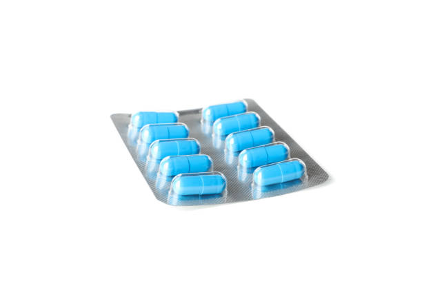 istock Blue capsules pills in blister pack isolated on white background 1189931185