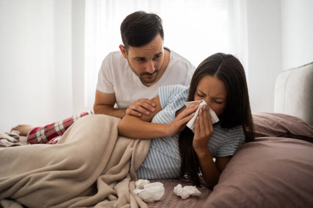 pares na cama - cold and flu flu virus bed couple - fotografias e filmes do acervo