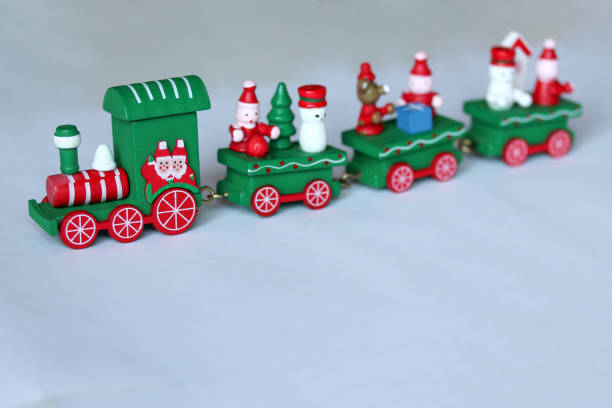istock Green festive wooden train on white background with copy space 1189932513