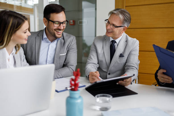 istock Team of business people working together using digital tablet 1189932785