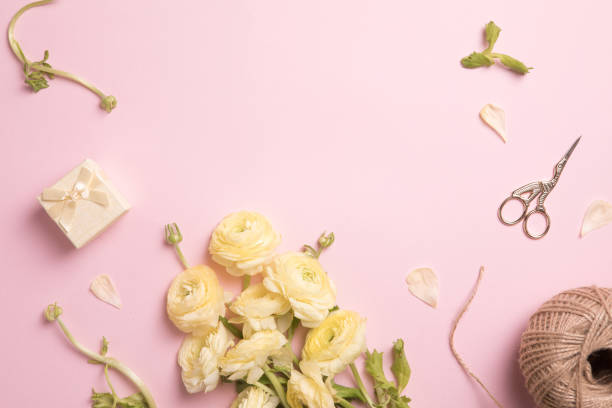 istock Flowers composition with flowers on pastel pink background. Flat lay, top view, copy space 1189934438